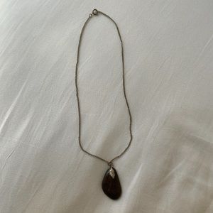 Silver color necklace with brown stone pendant